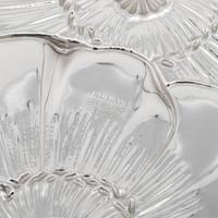 A Group of Four American Silver Repoussé-Decorated Trinket Dishes