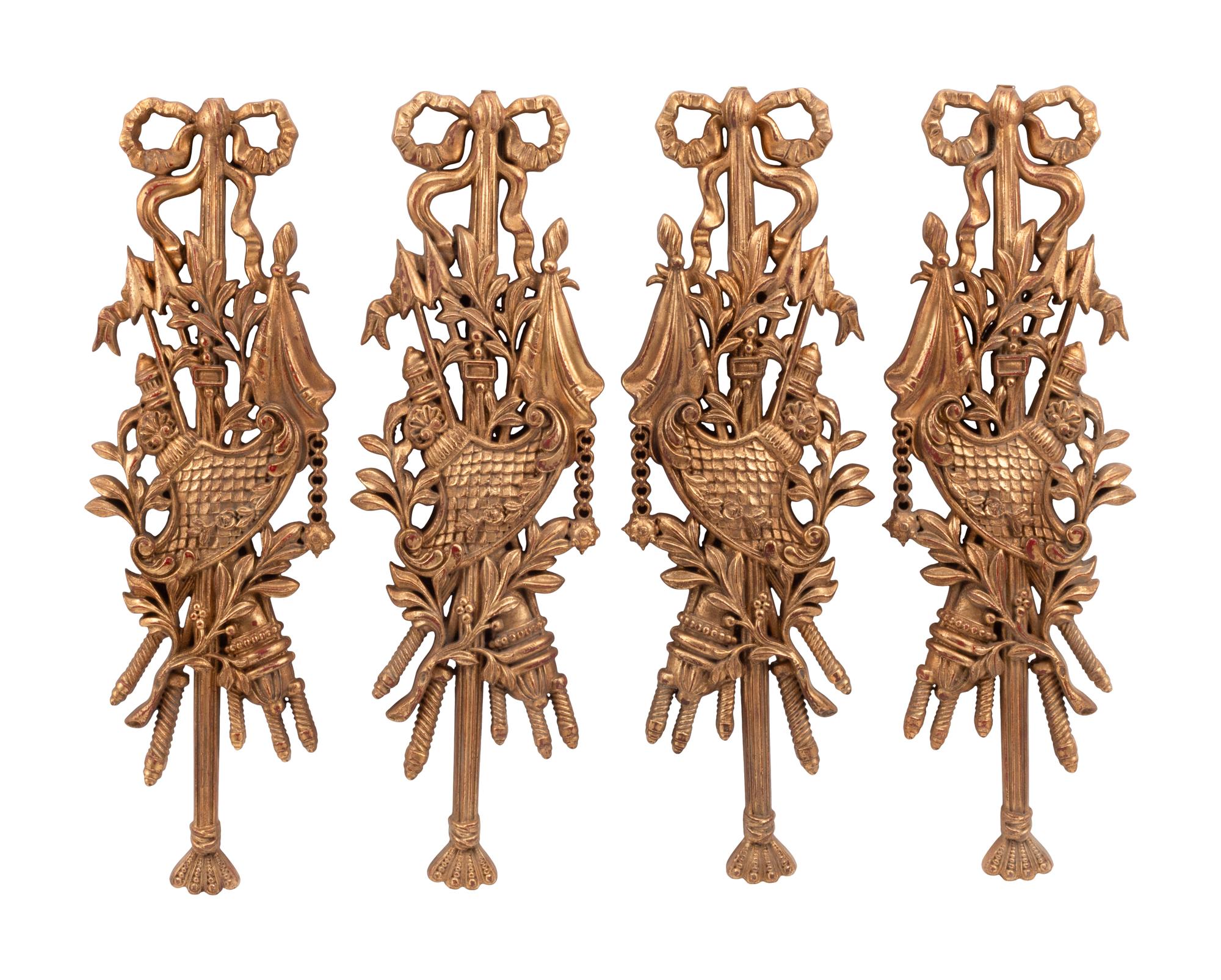 A Set of Four French Carved Giltwood Plaques