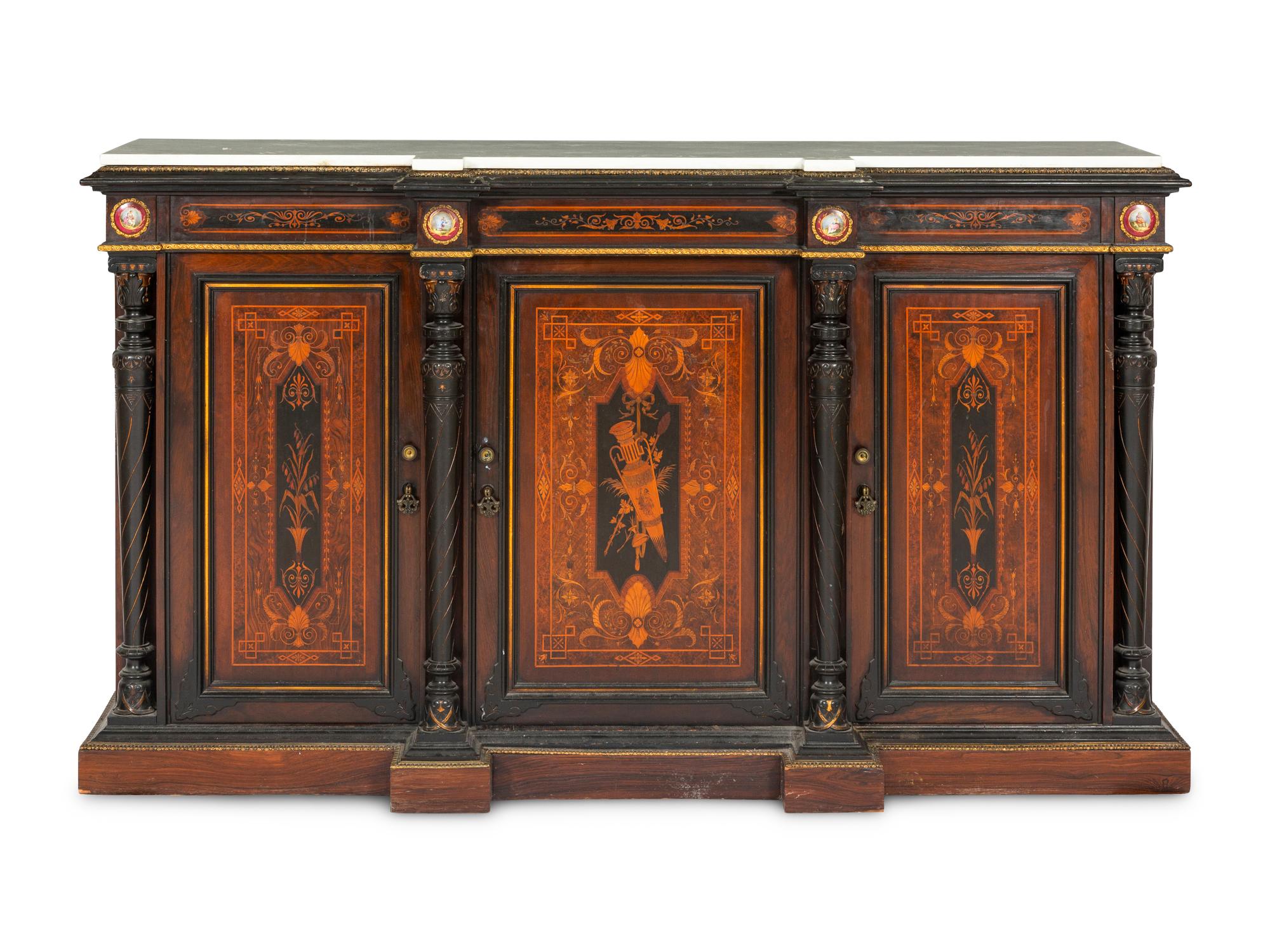 A Victorian Renaissance Revival Marquetry Inlaid and Parcel Ebonized Credenza in the Manner of Herter Brothers