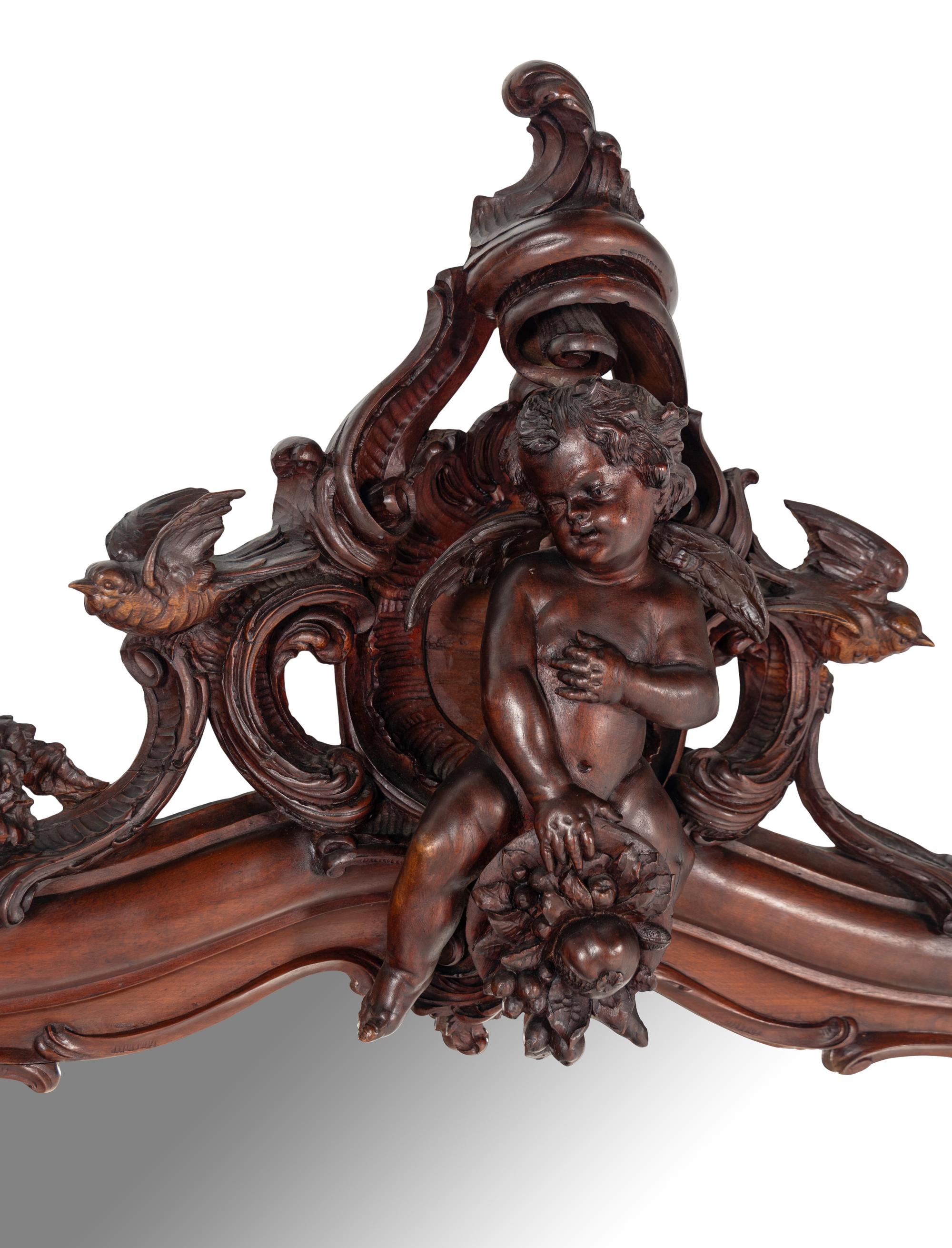 An Italian Rococo Revival Carved Walnut Mirror