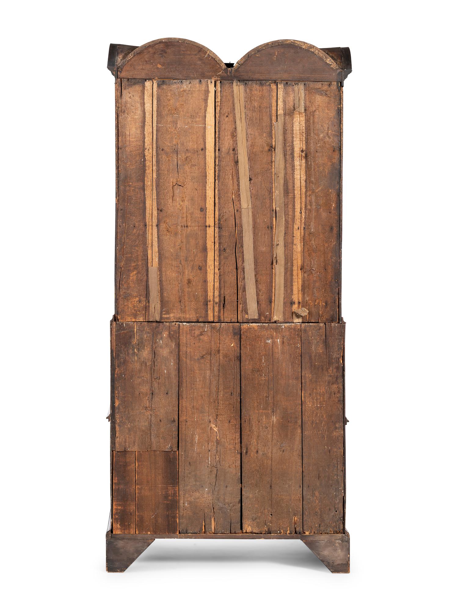 A Queen Anne Walnut Double Bonnet Secretary Bookcase