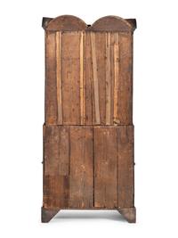 A Queen Anne Walnut Double Bonnet Secretary Bookcase