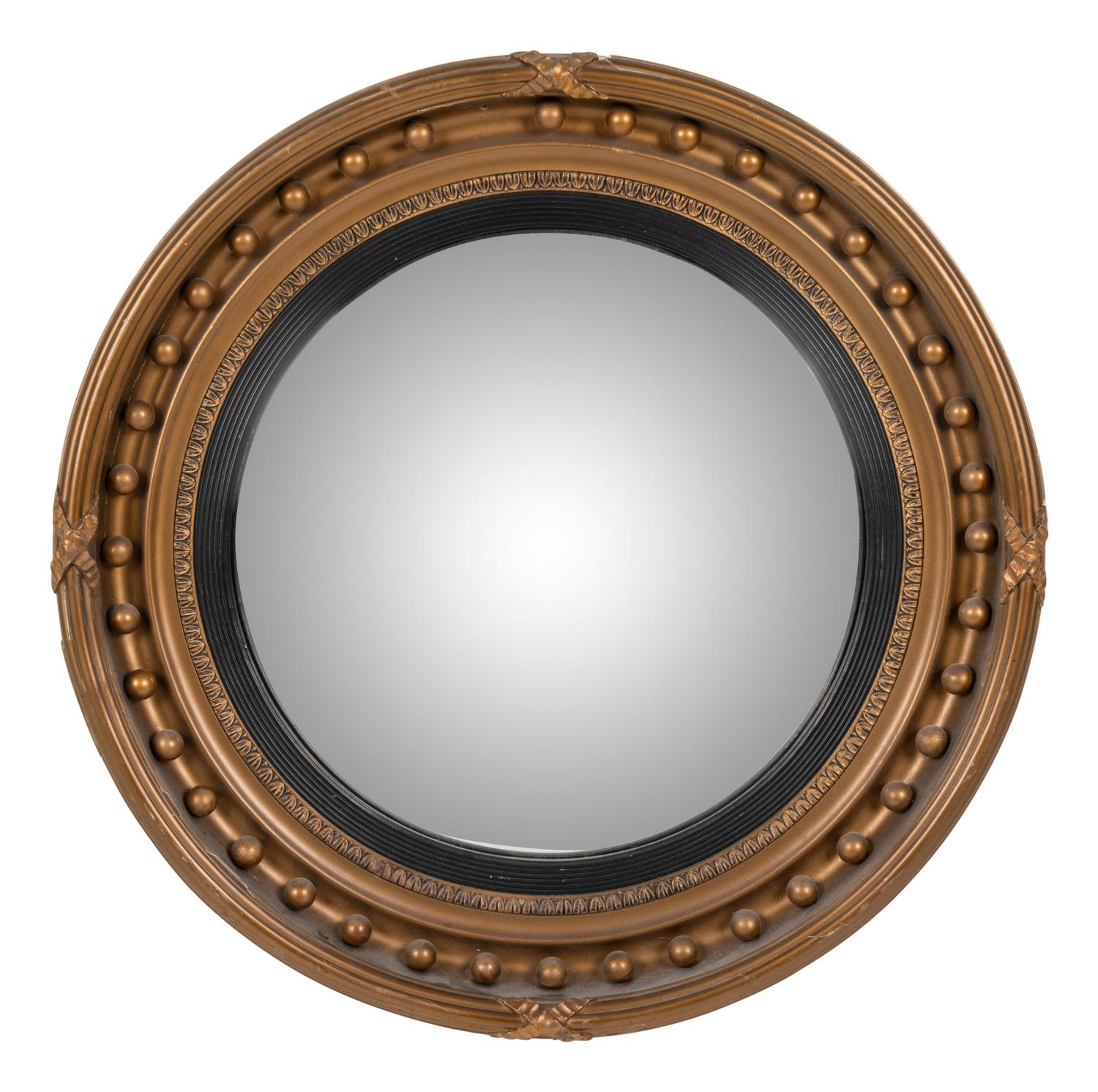 A Regency Giltwood and Ebonized Convex Mirror