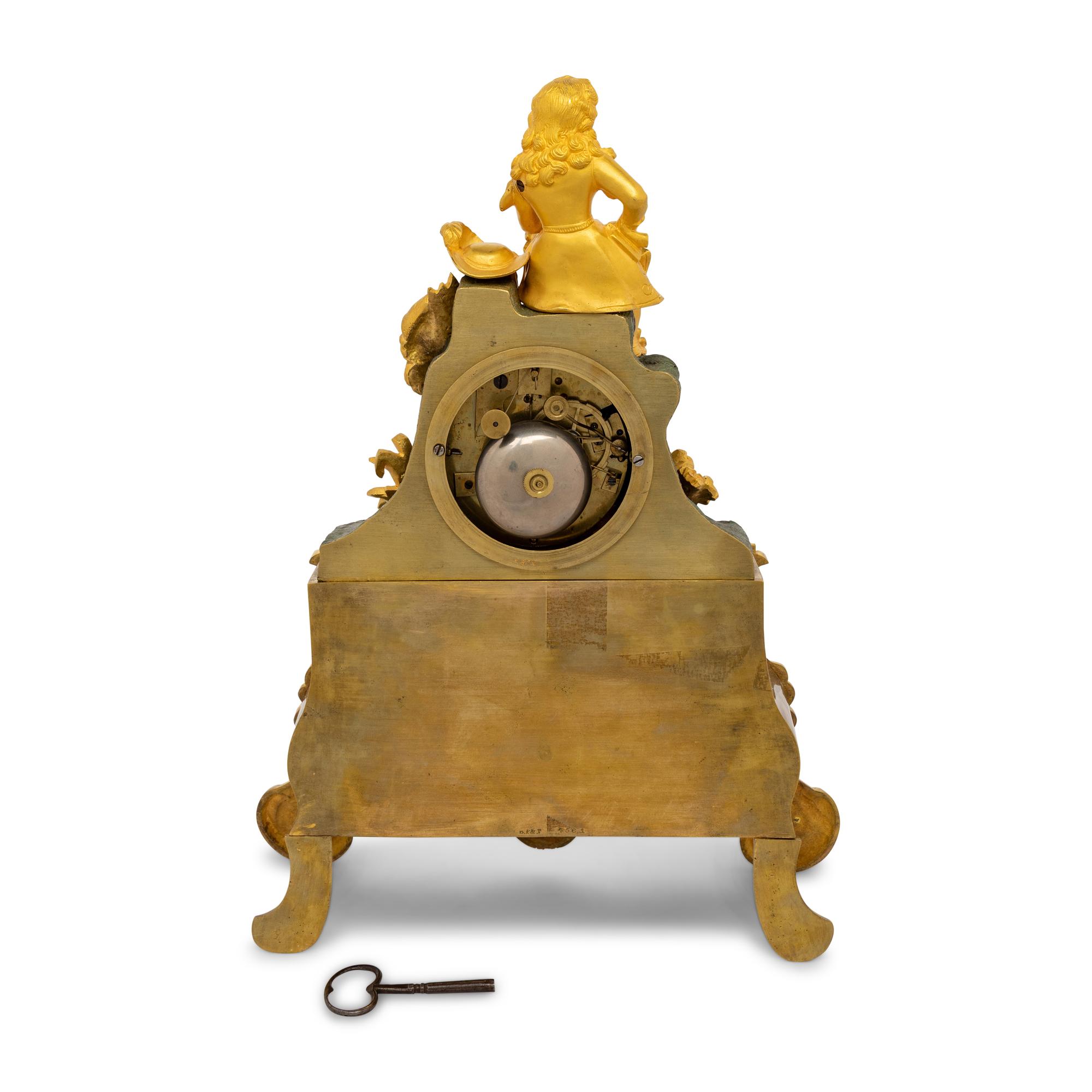 A Louis Philippe Gilt and Patinated Bronze Mantel Clock