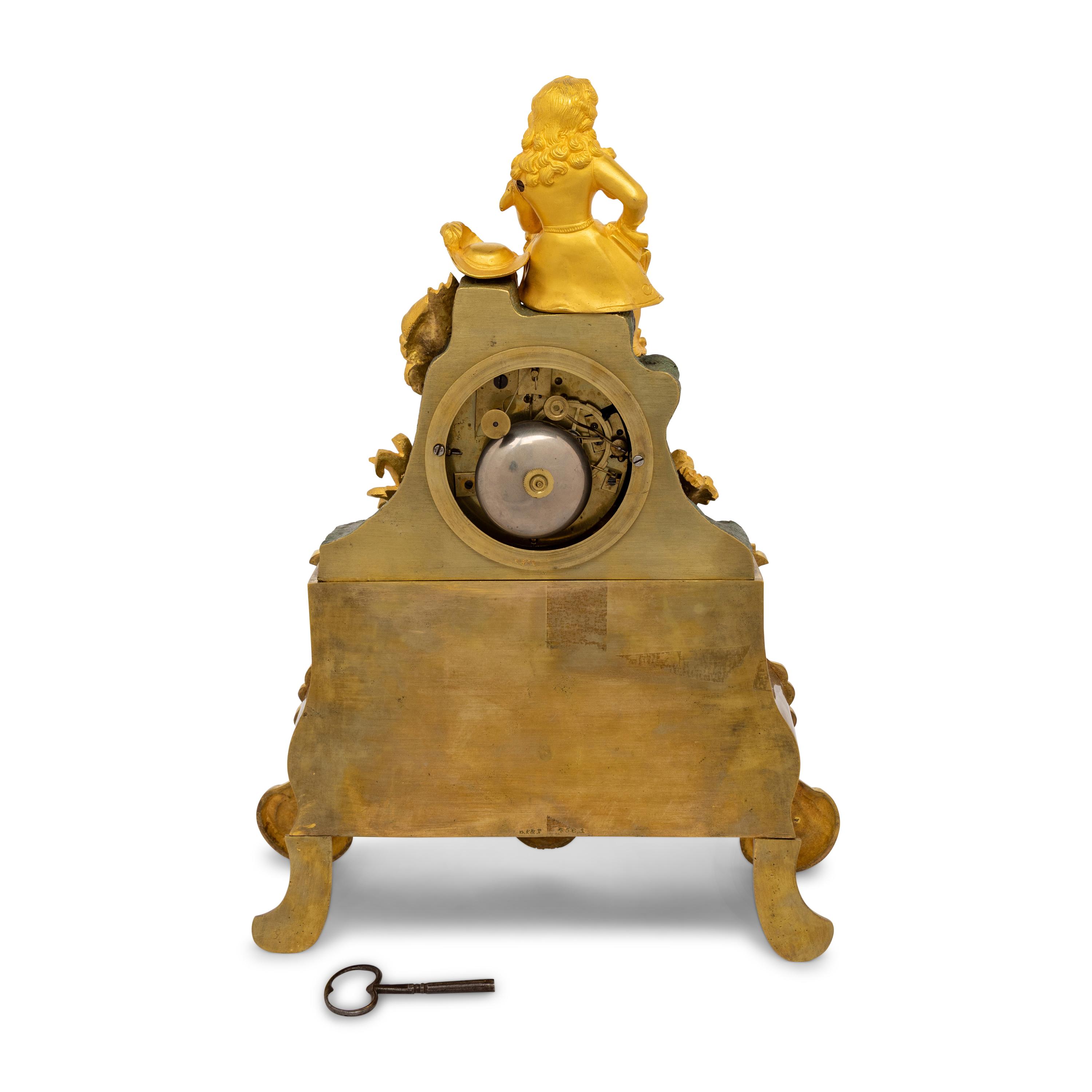 A Louis Philippe Gilt and Patinated Bronze Mantel Clock