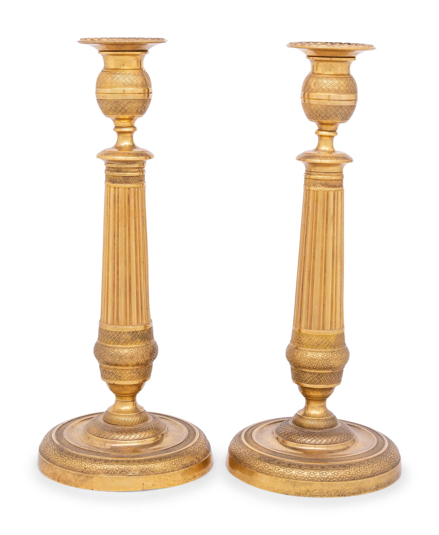 A Pair of Continental Gilt Metal Candlesticks