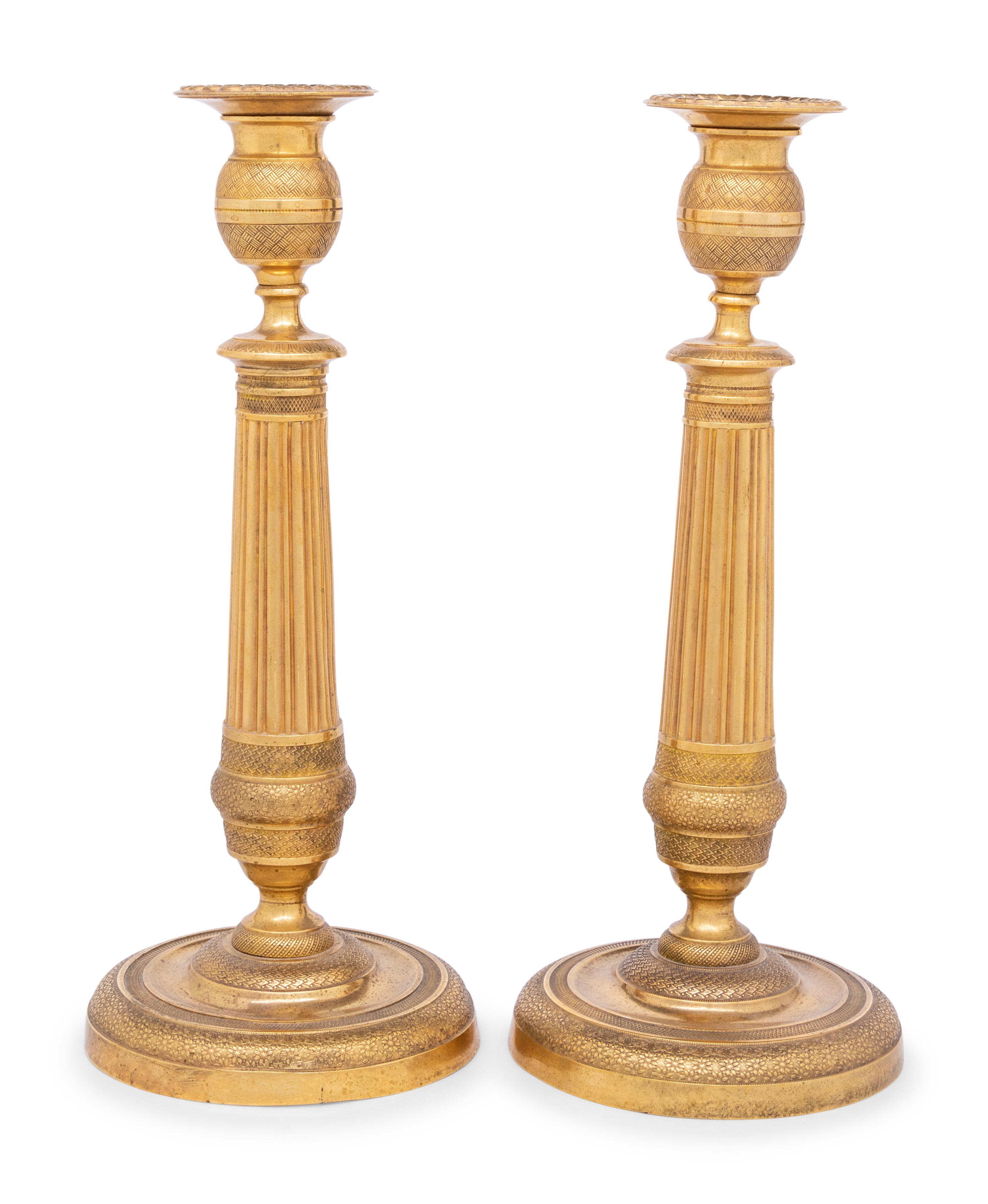 A Pair of Continental Gilt Metal Candlesticks