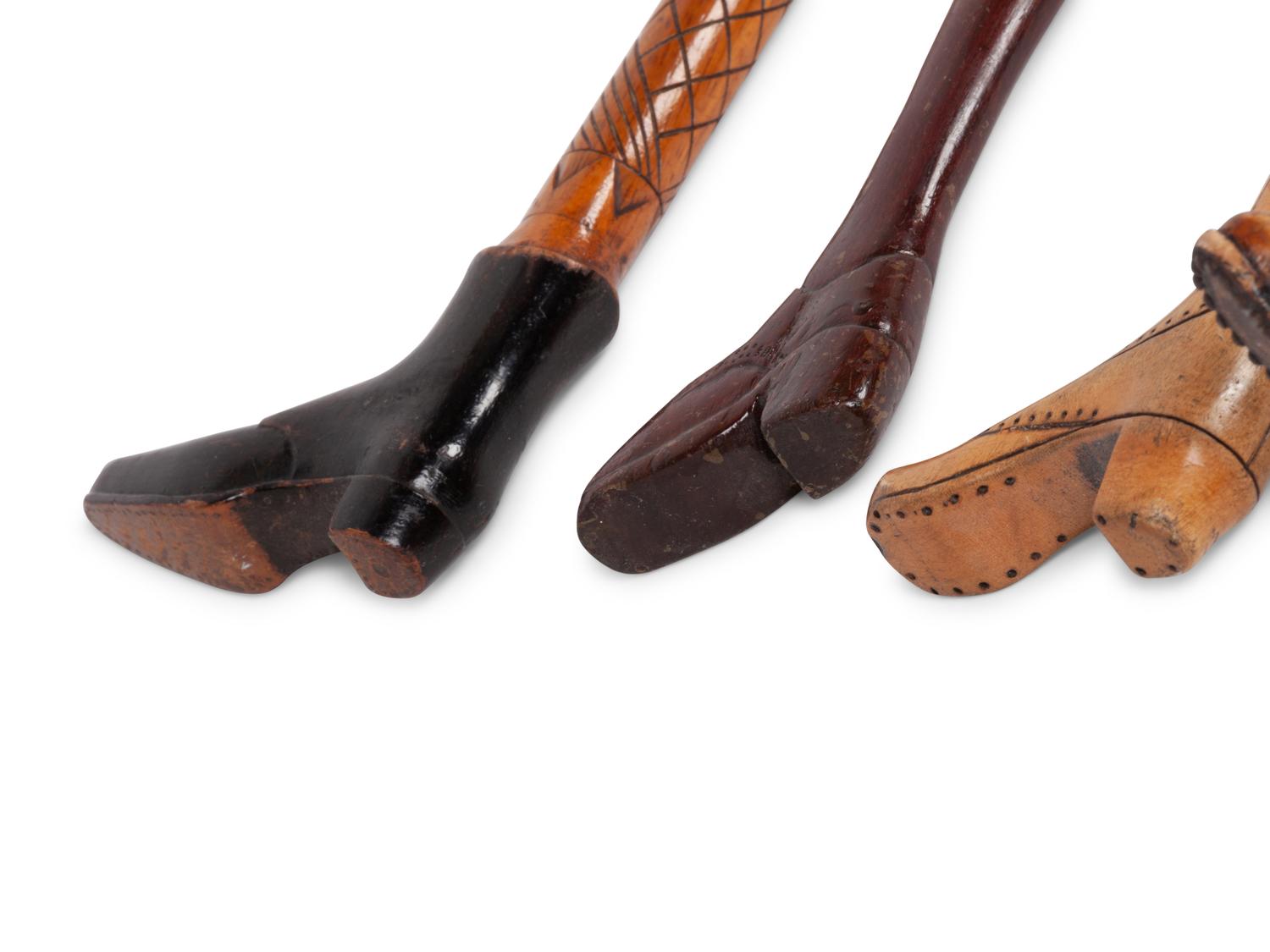 A Group of Folk Art Carved Shoe-Form Canes