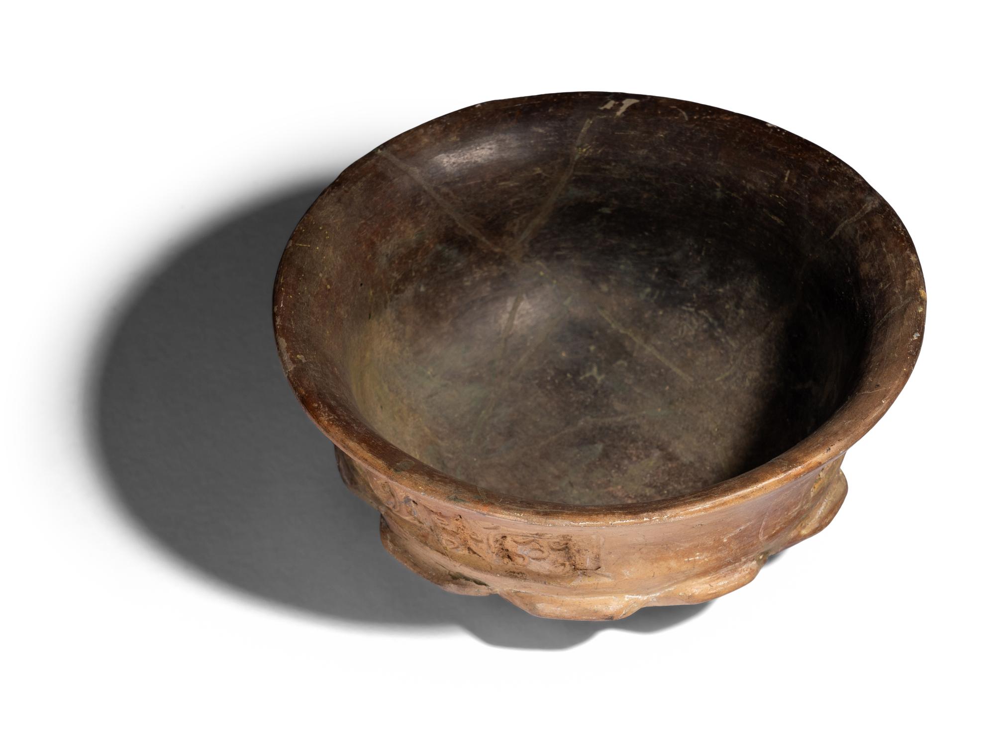 A Maya Terracotta Vessel with Glyphs
