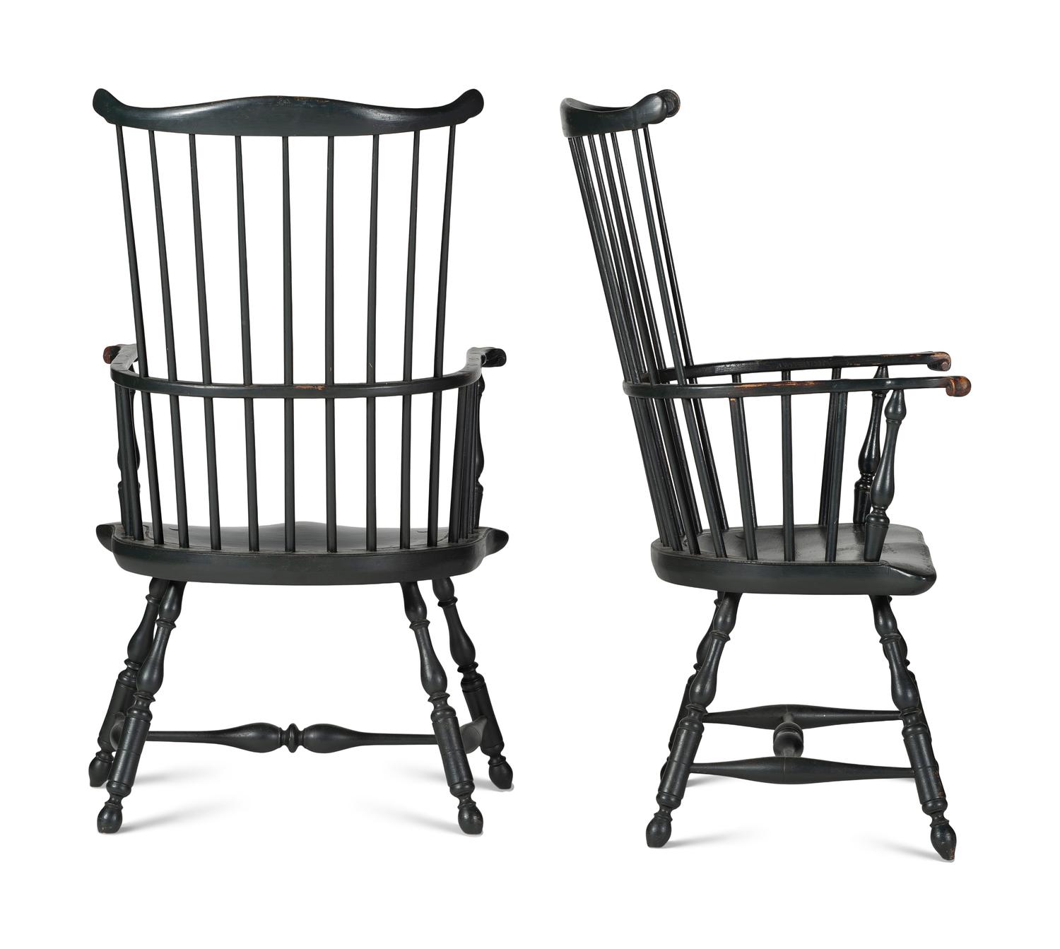 A Pair of Various Wood Black Painted Volute and Knuckle Carved Comb-Back Windsor Armchairs