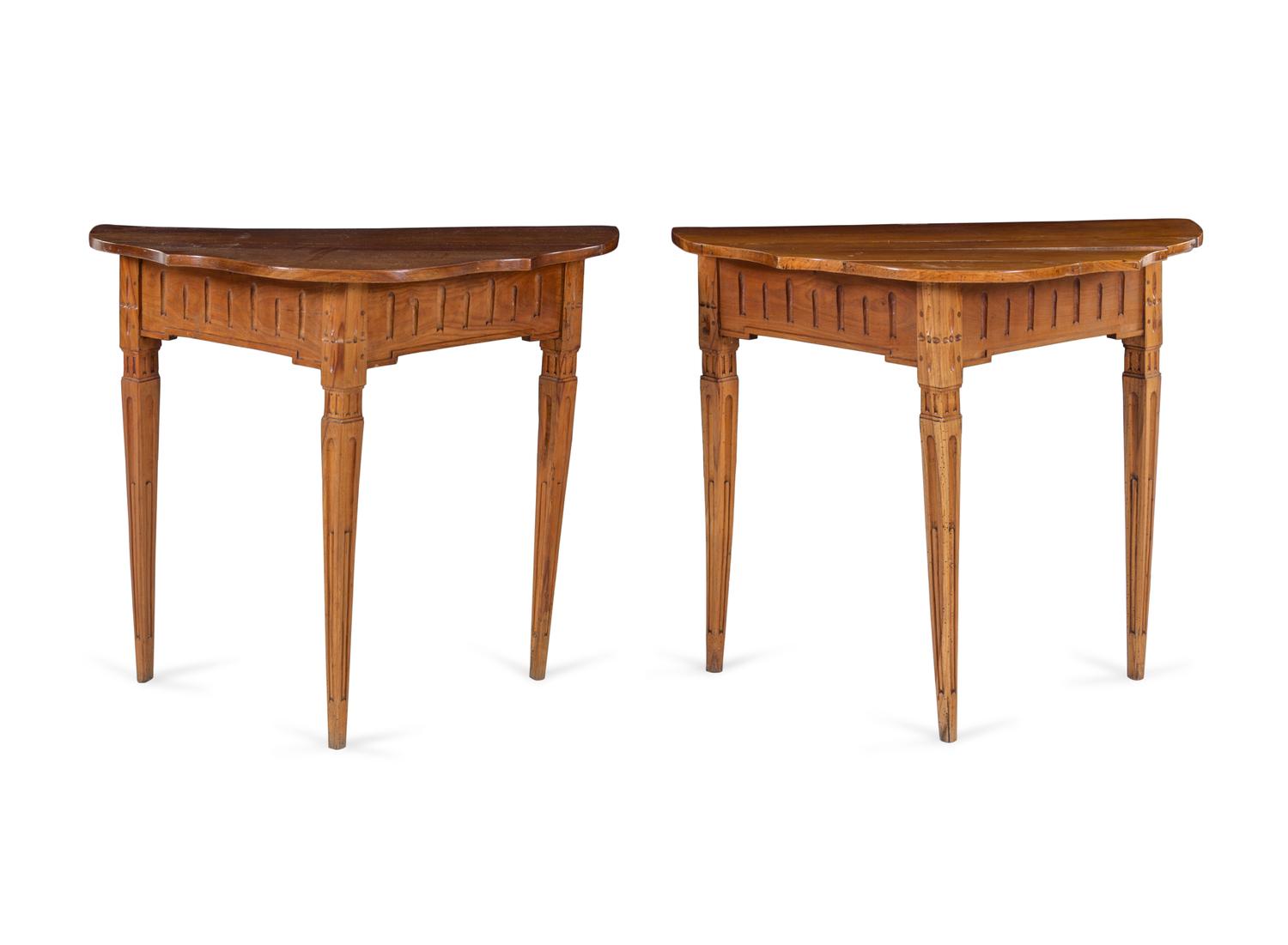 A Pair of Continental Carved Fruitwood Console Tables