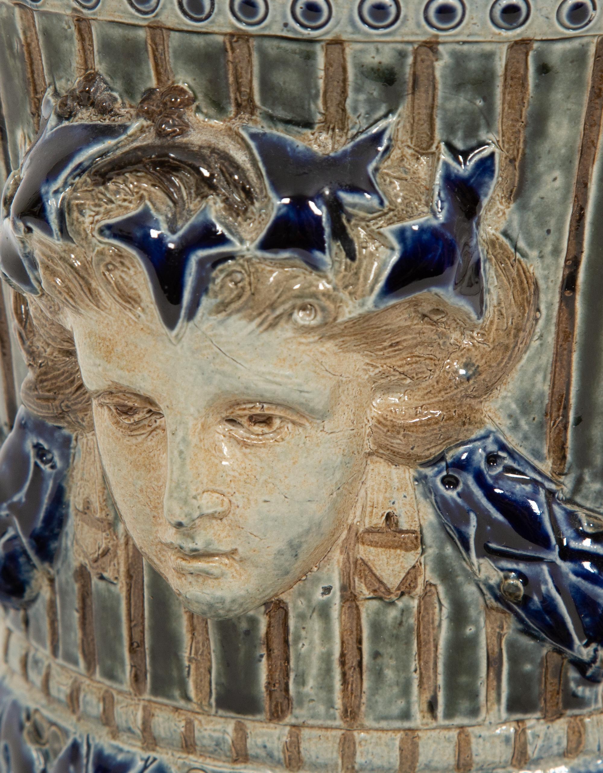 An English Majolica Jardiniere with Stand and a Cistern-form Wall Pocket