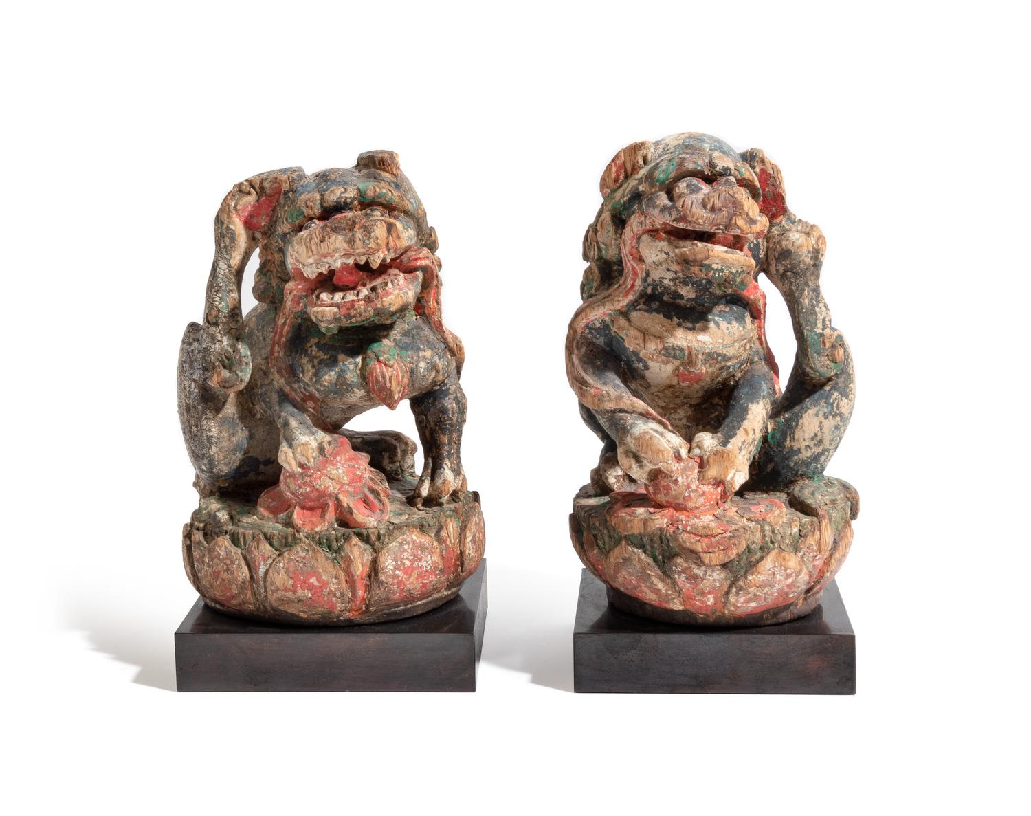 A Pair of Chinese Polychrome Painted Wood Figures of Fu Lions