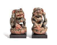 A Pair of Chinese Polychrome Painted Wood Figures of Fu Lions