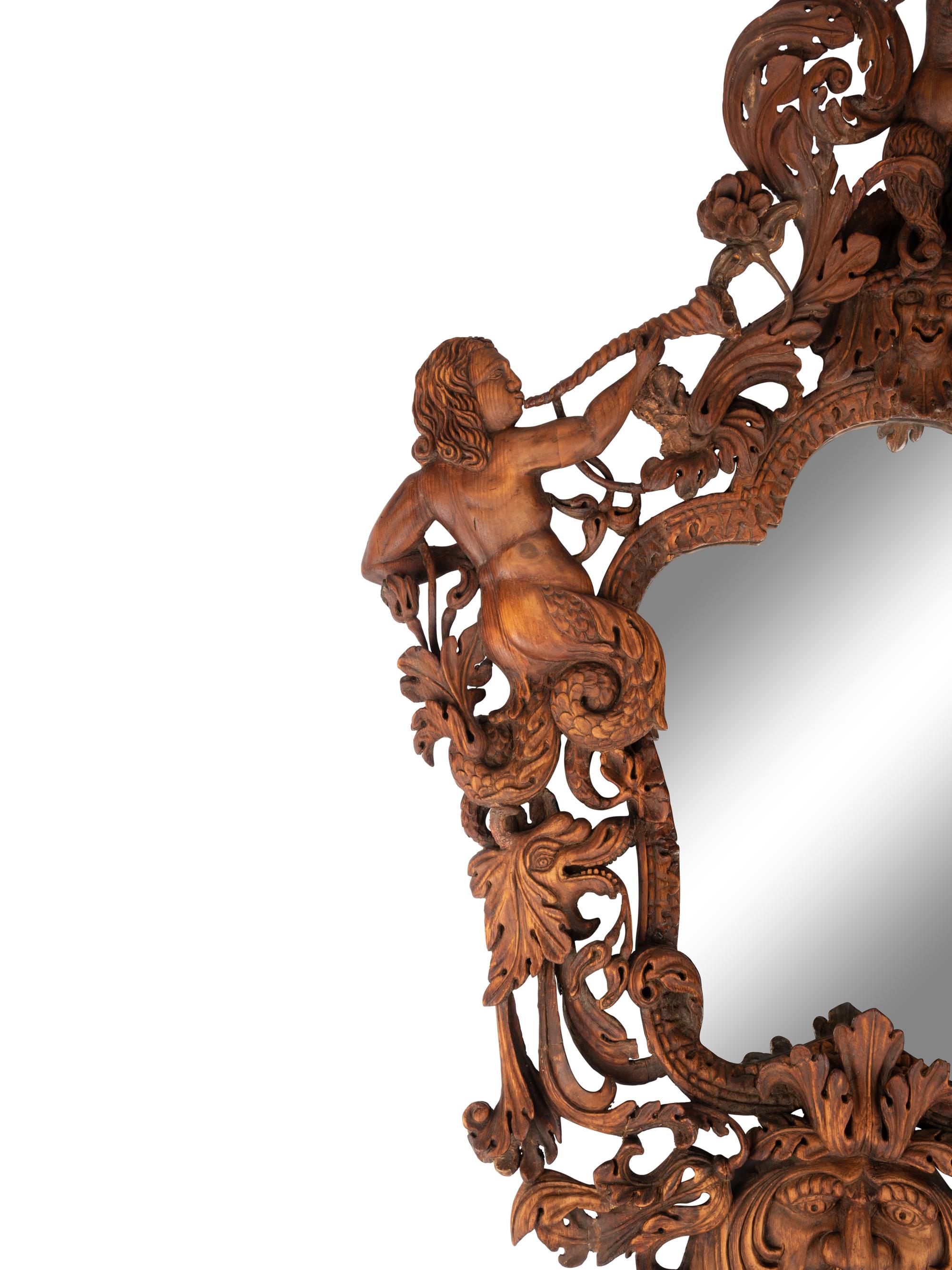 An Italian Carved Walnut Mirror in the Manner of Valentino Besarel