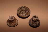 A Group of Six Quimbaya Terracotta Spindle Whorls