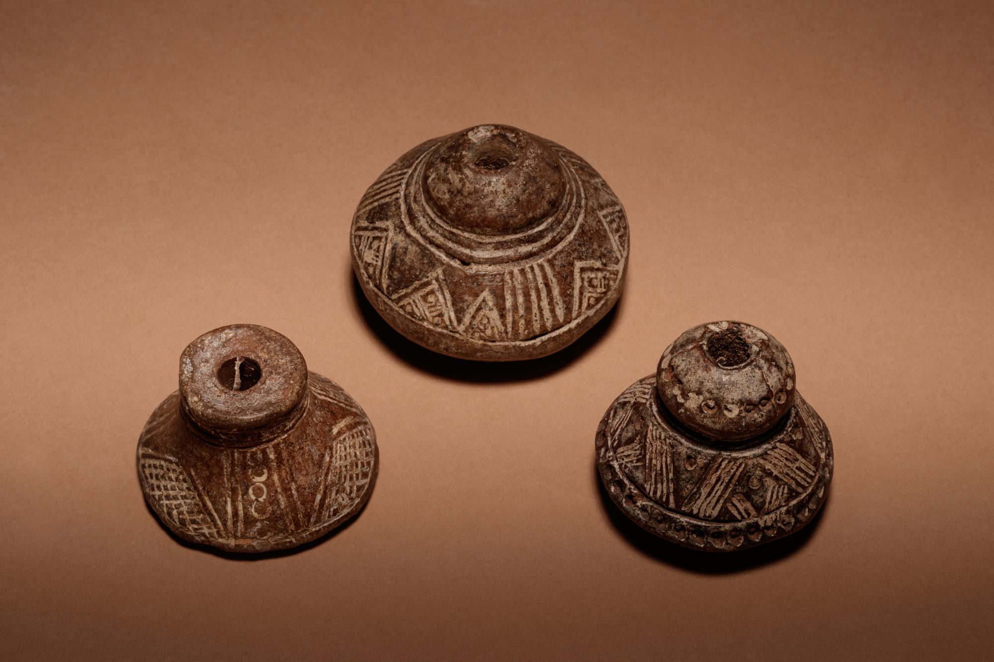 A Group of Six Quimbaya Terracotta Spindle Whorls