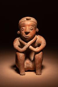 A Colima Terracotta Squatting Figure