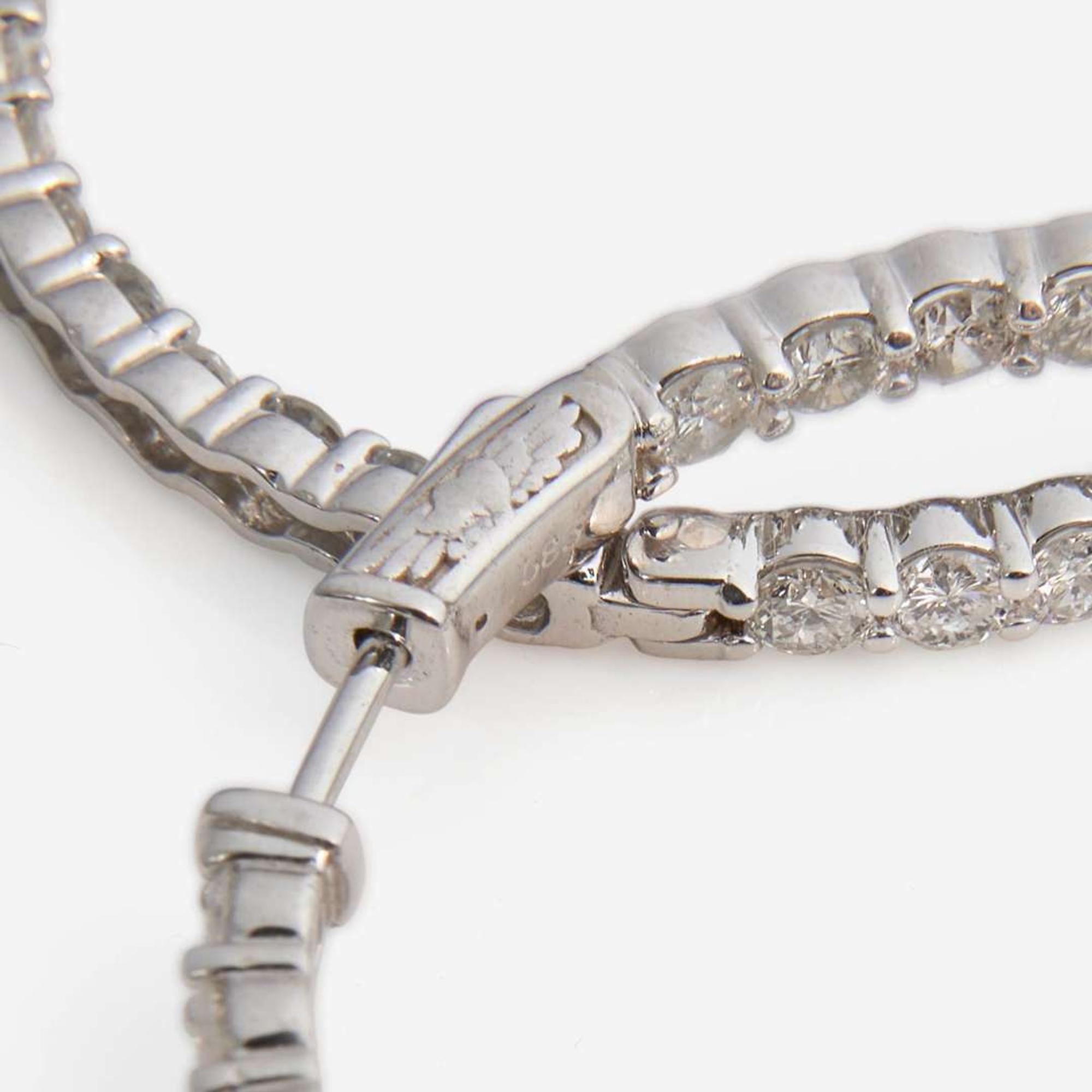A Pair of Diamond and 14K White Gold Earrings