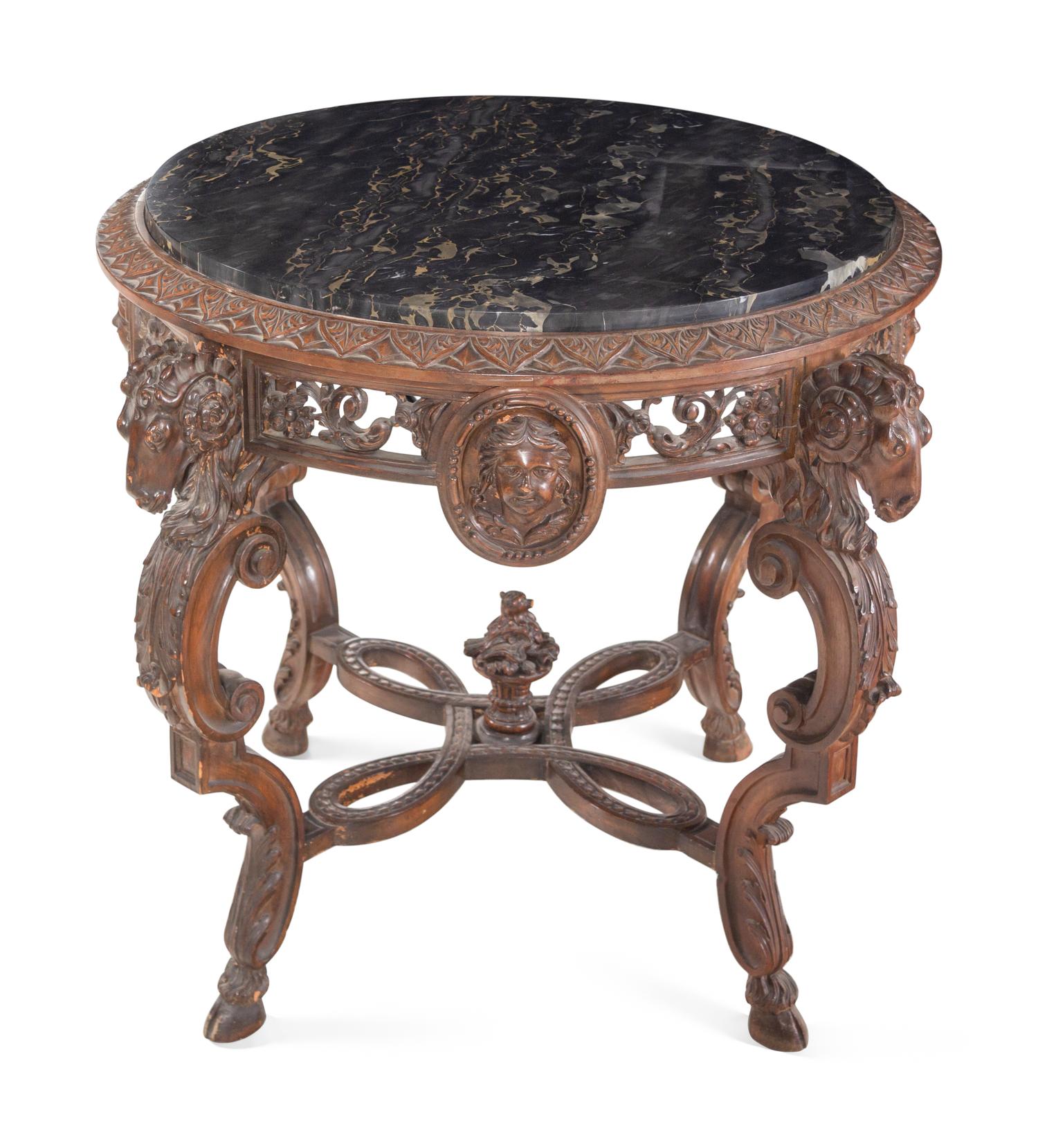 An Italian Carved Walnut Marble-Top Table