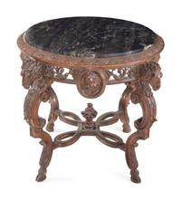 An Italian Carved Walnut Marble-Top Table