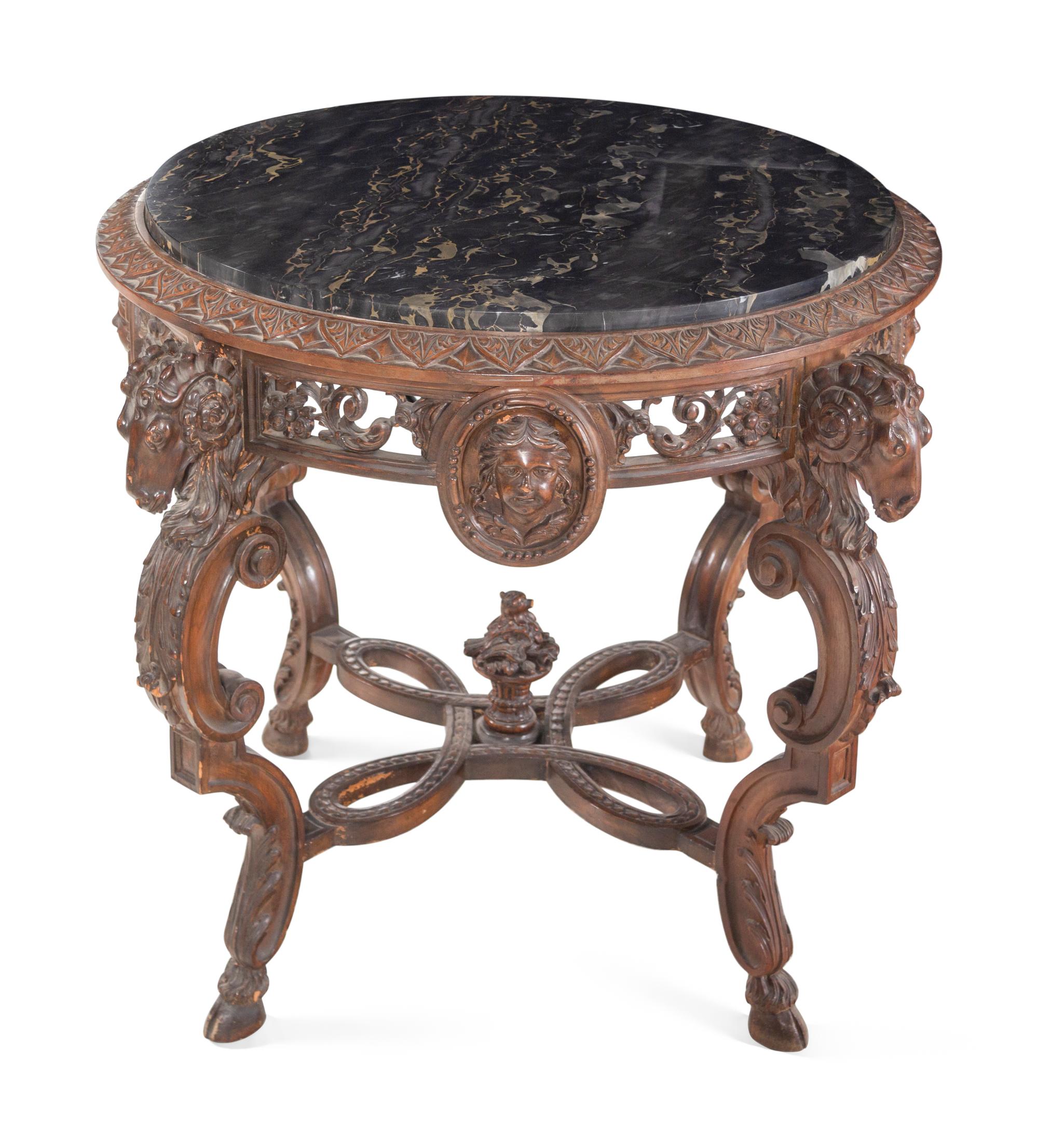 An Italian Carved Walnut Marble-Top Table