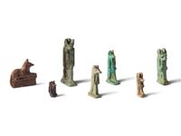 Seven Egyptian Faience and Stone Anubis Amulets