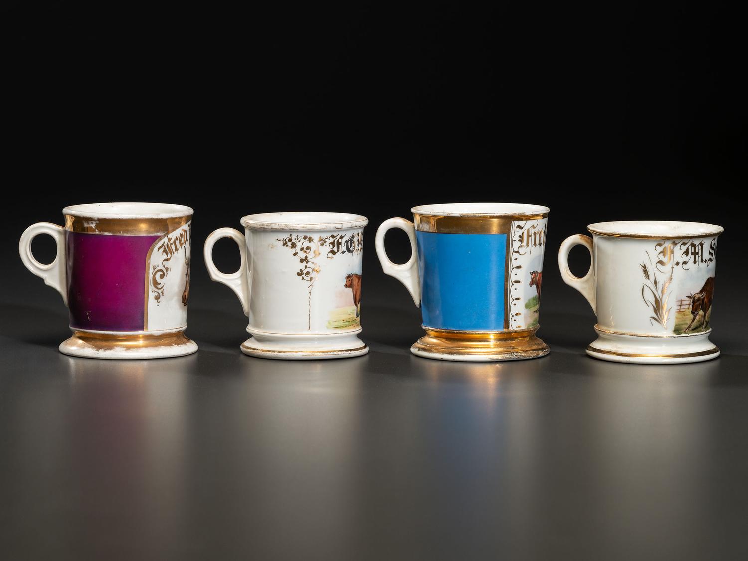 Four Porcelain Occupational Shaving Mugs of Bovine Interest