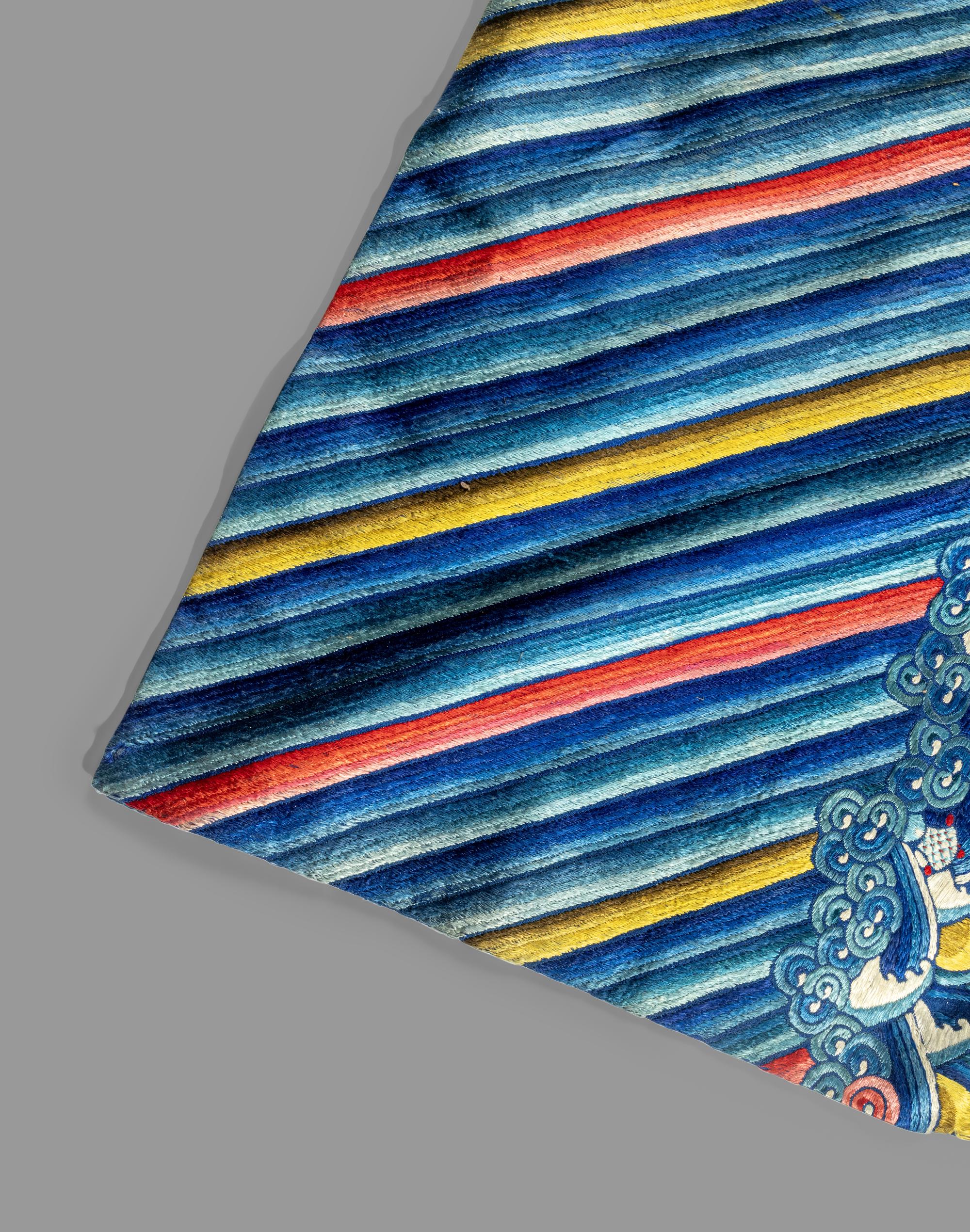 A Chinese Blue Ground Embroidered Silk 'Dragon' Robe