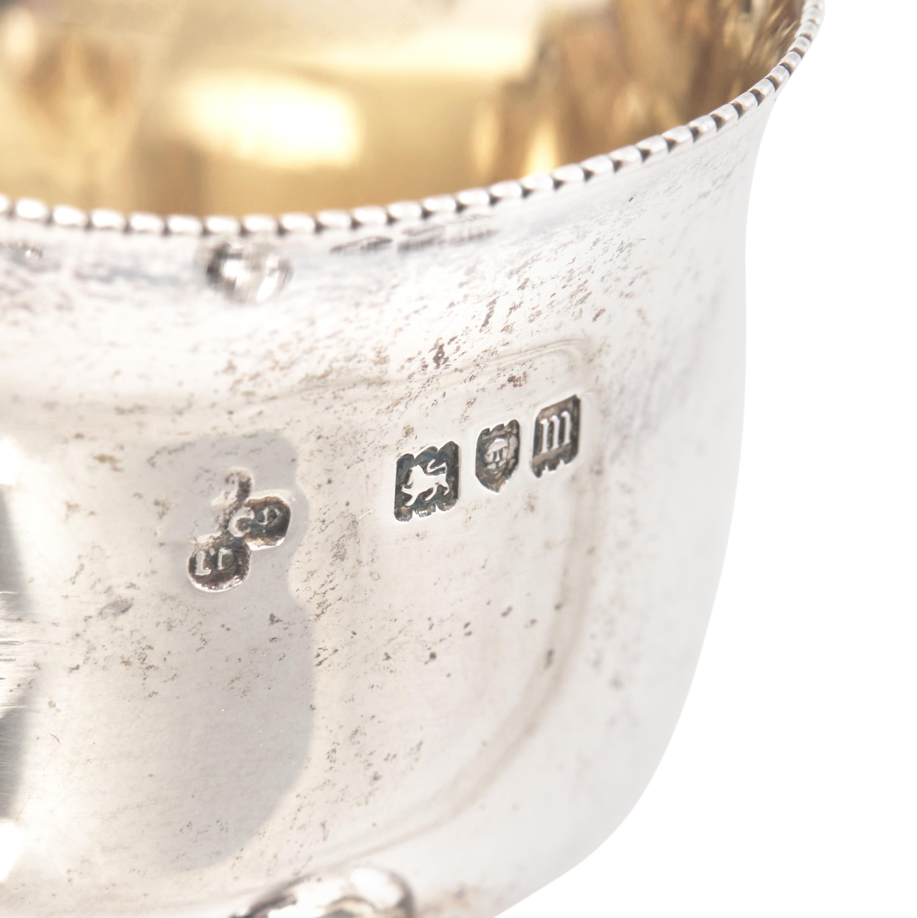 A Set of Four English Silver Trefoil Salt Cellars and a Silver Toast Rack