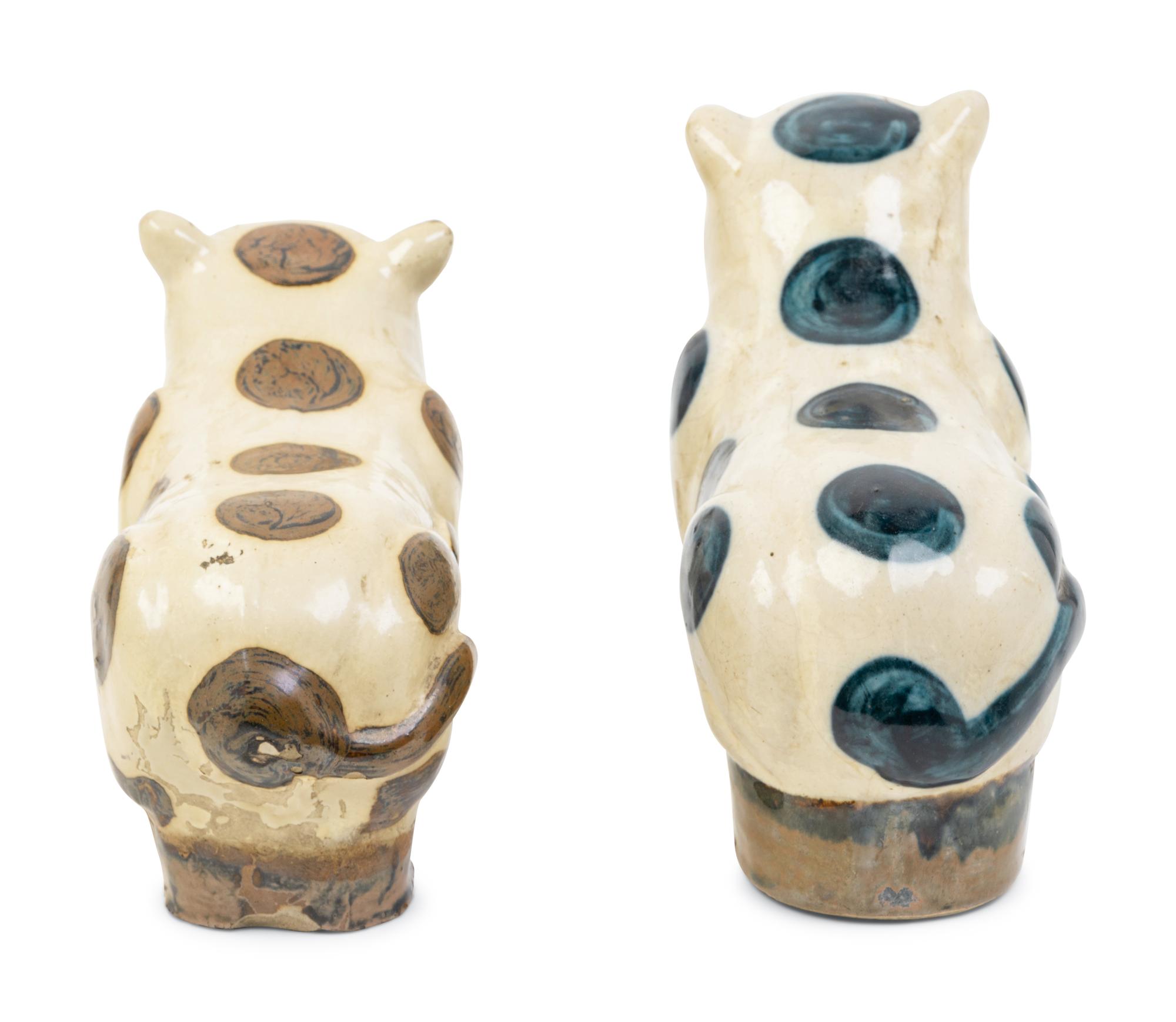 Two Chinese Beige Ground Porcelain 'Cat' Pillows