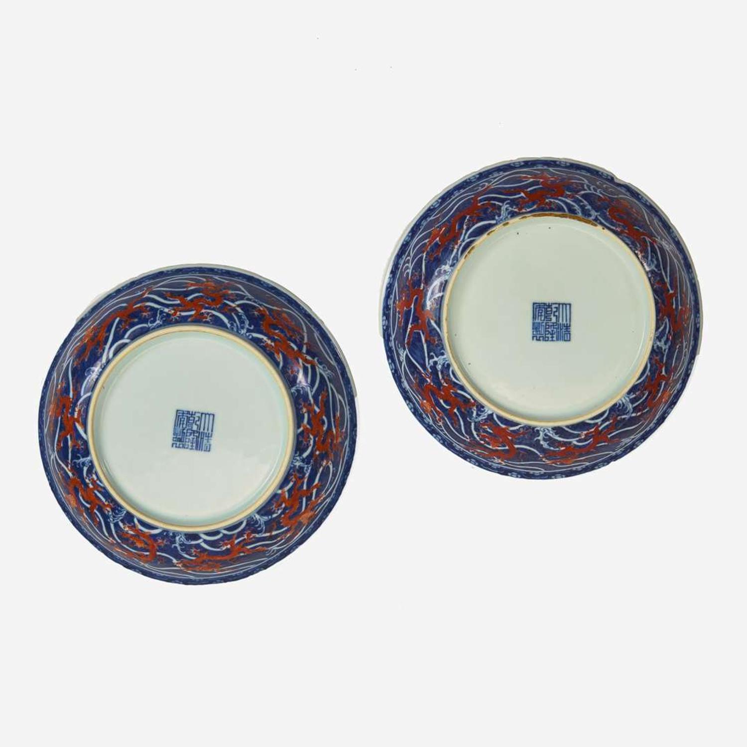 An associated pair of iron-red and underglaze blue "Dragon" Dishes 礬红青花龙纹盘子 或为一对 Qianlong six-character seal mark and of the period ????? ? ??