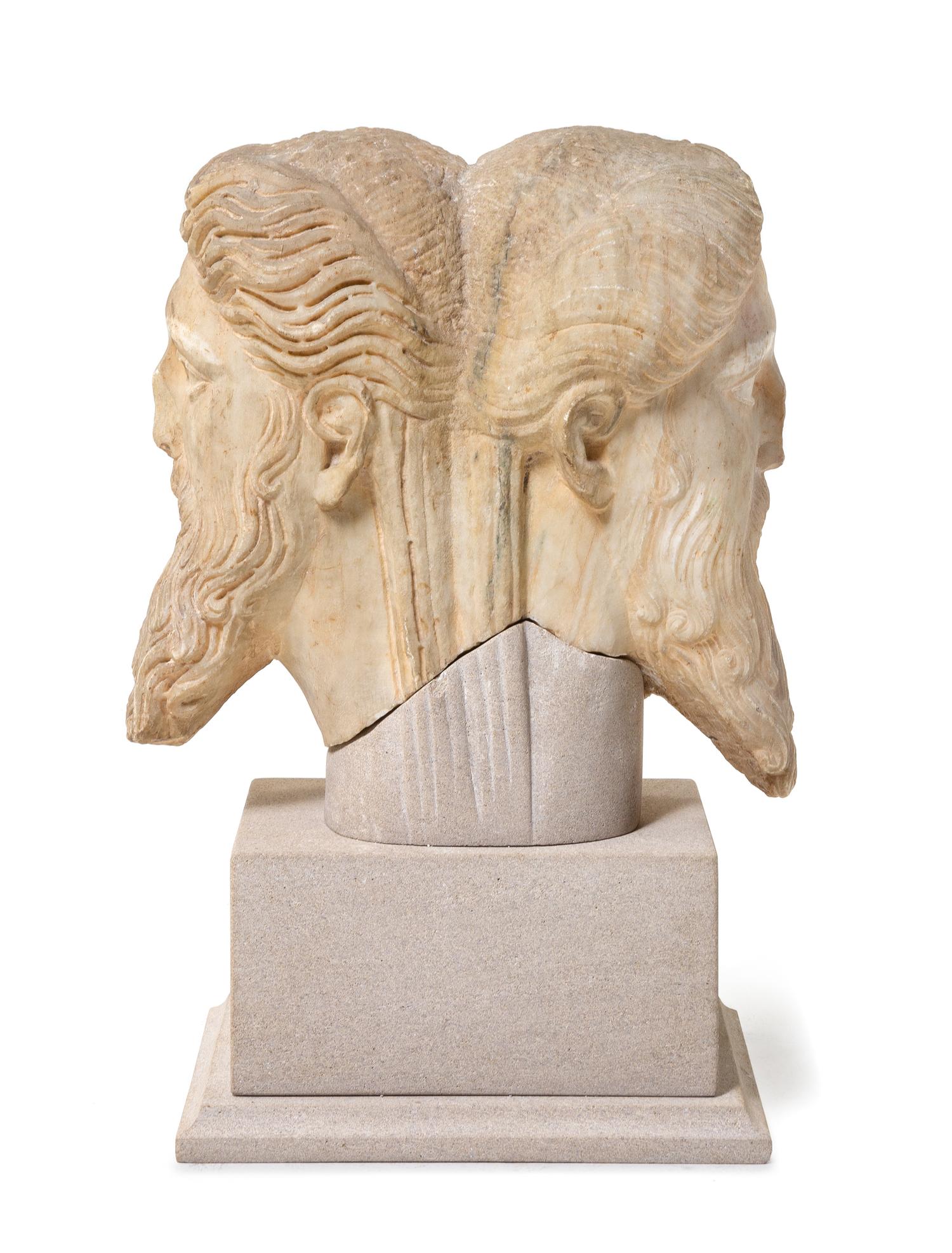 A Roman Marble Janiform Herm Head Height 13 1/2 inches. — CIRCA LATE 1ST-EARLY 2ND CENTURY C.E.