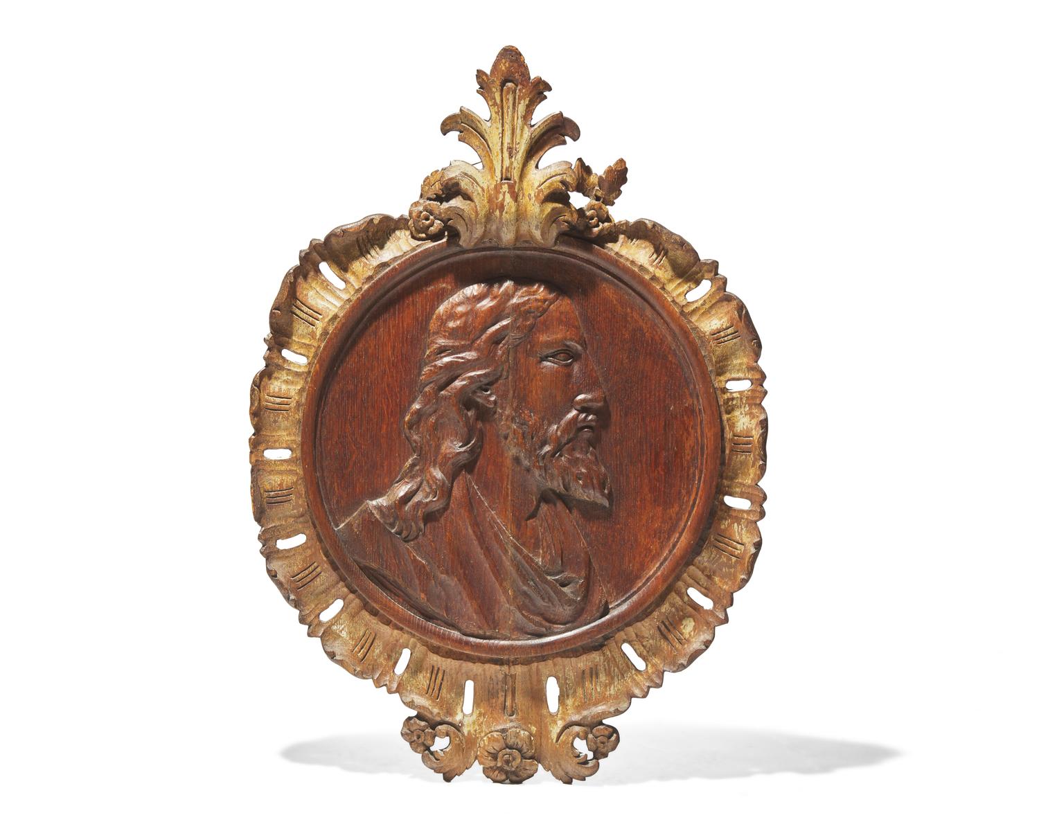 A Flemish carved oak bas relief profile portrait of Christ, 17th century