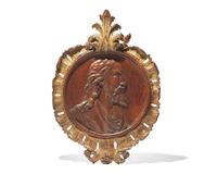 A Flemish carved oak bas relief profile portrait of Christ, 17th century