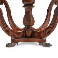 A Regency Style Walnut and Marble-Top Center Table