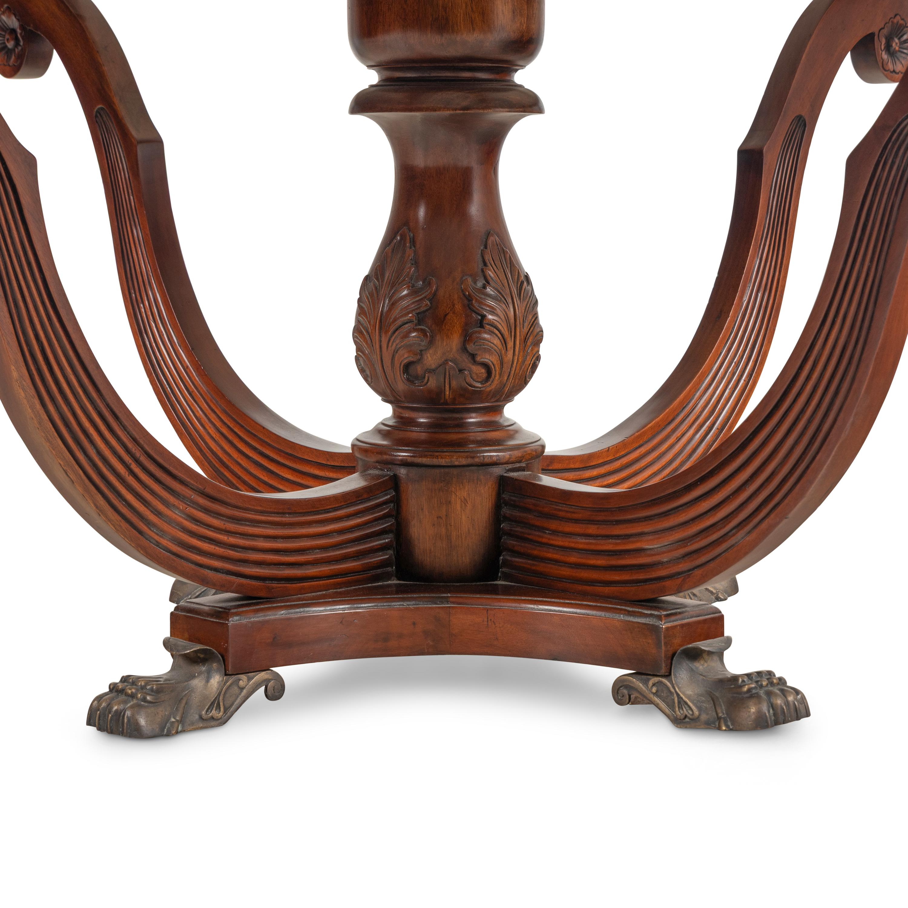 A Regency Style Walnut and Marble-Top Center Table