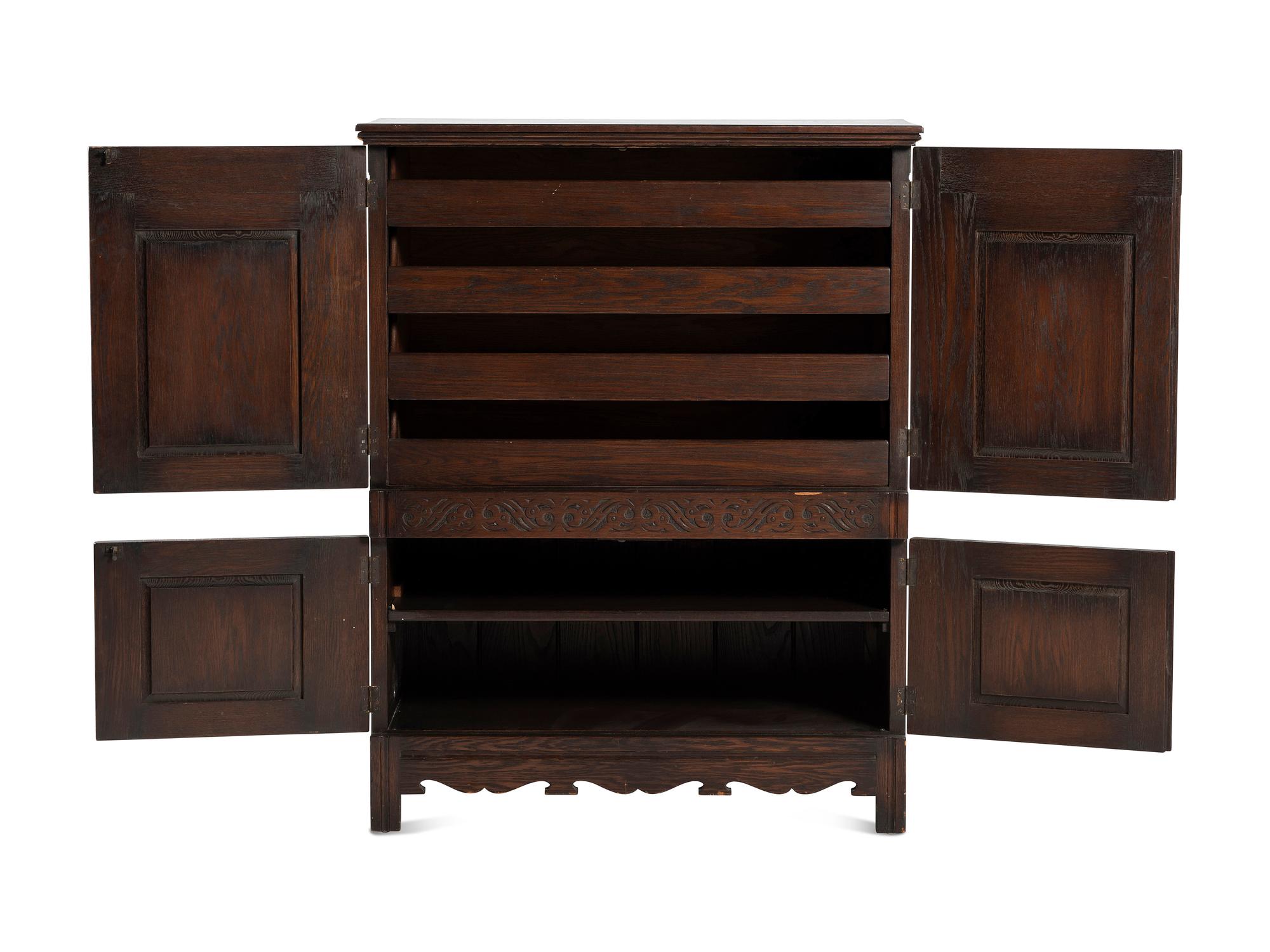 A Jacobean Style Carved Oak Cabinet