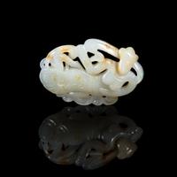 A Chinese White and Russet Jade Pendant