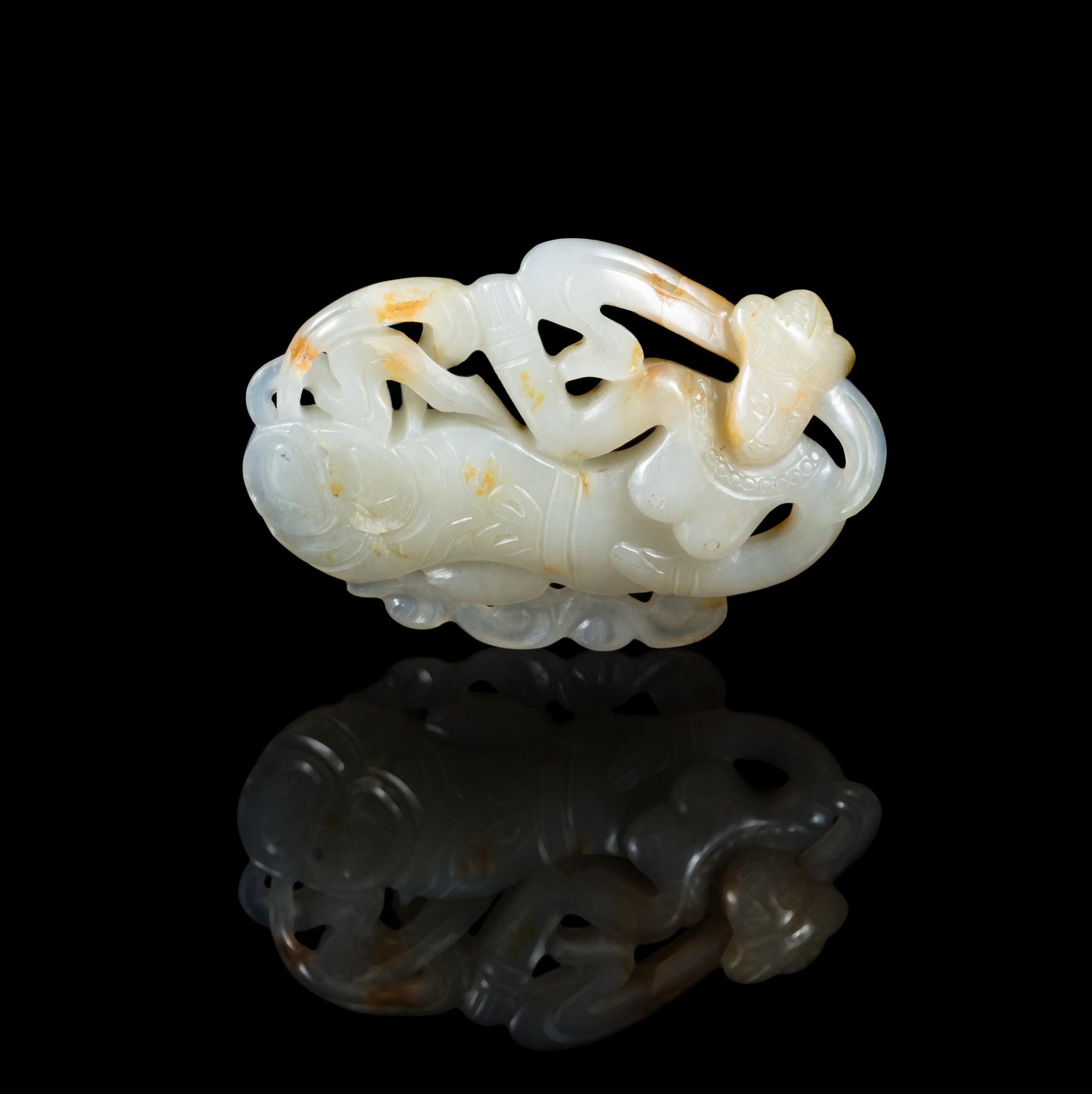 A Chinese White and Russet Jade Pendant