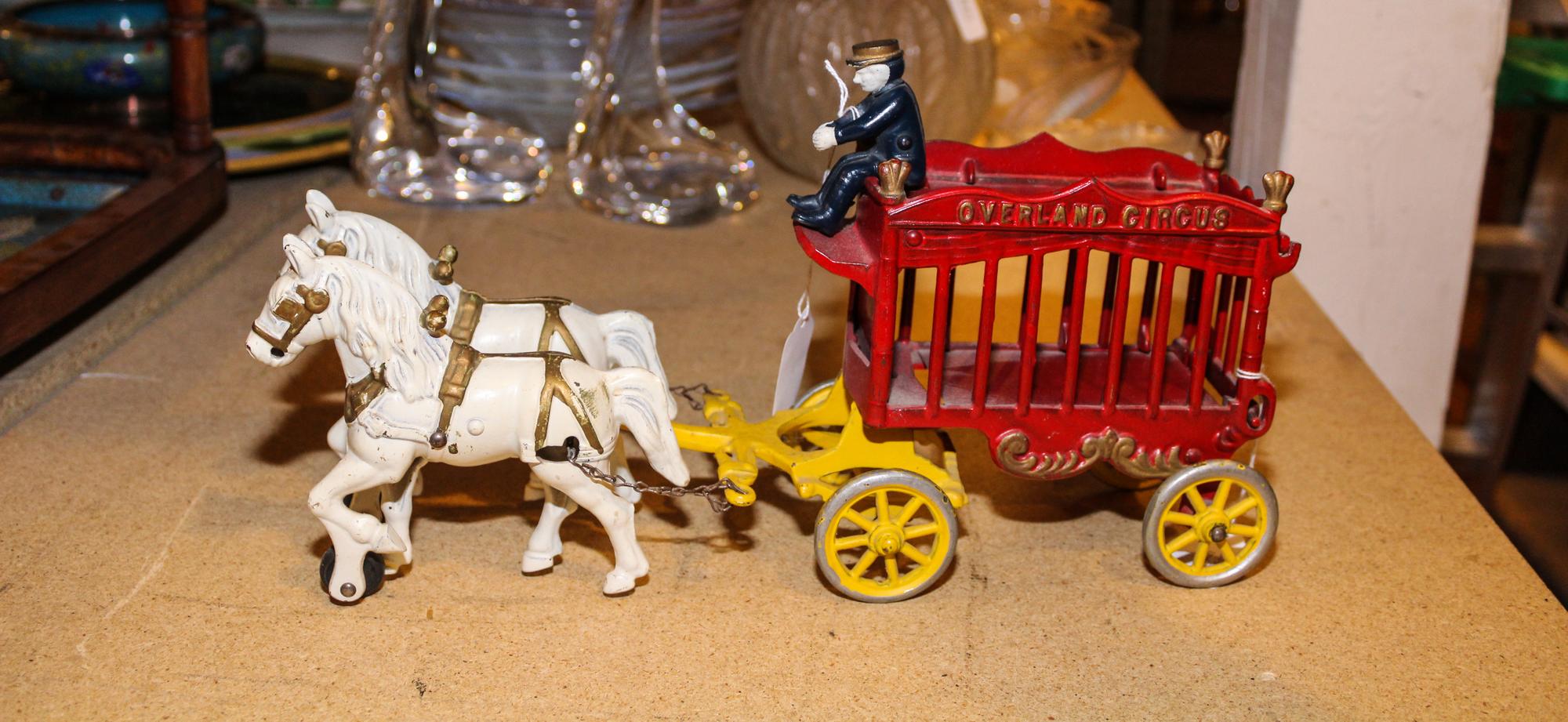 A Cast Iron Toy Wagon, Overland Circus Length overall 13 inches. — EARLY 20TH CENTURY
