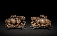A Pair of Chinese Brown Hardstone 'Ox and Herd' Figural Groups