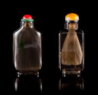 Two Lead Glass Snuff Bottles Height of each 2 3/4 inches.