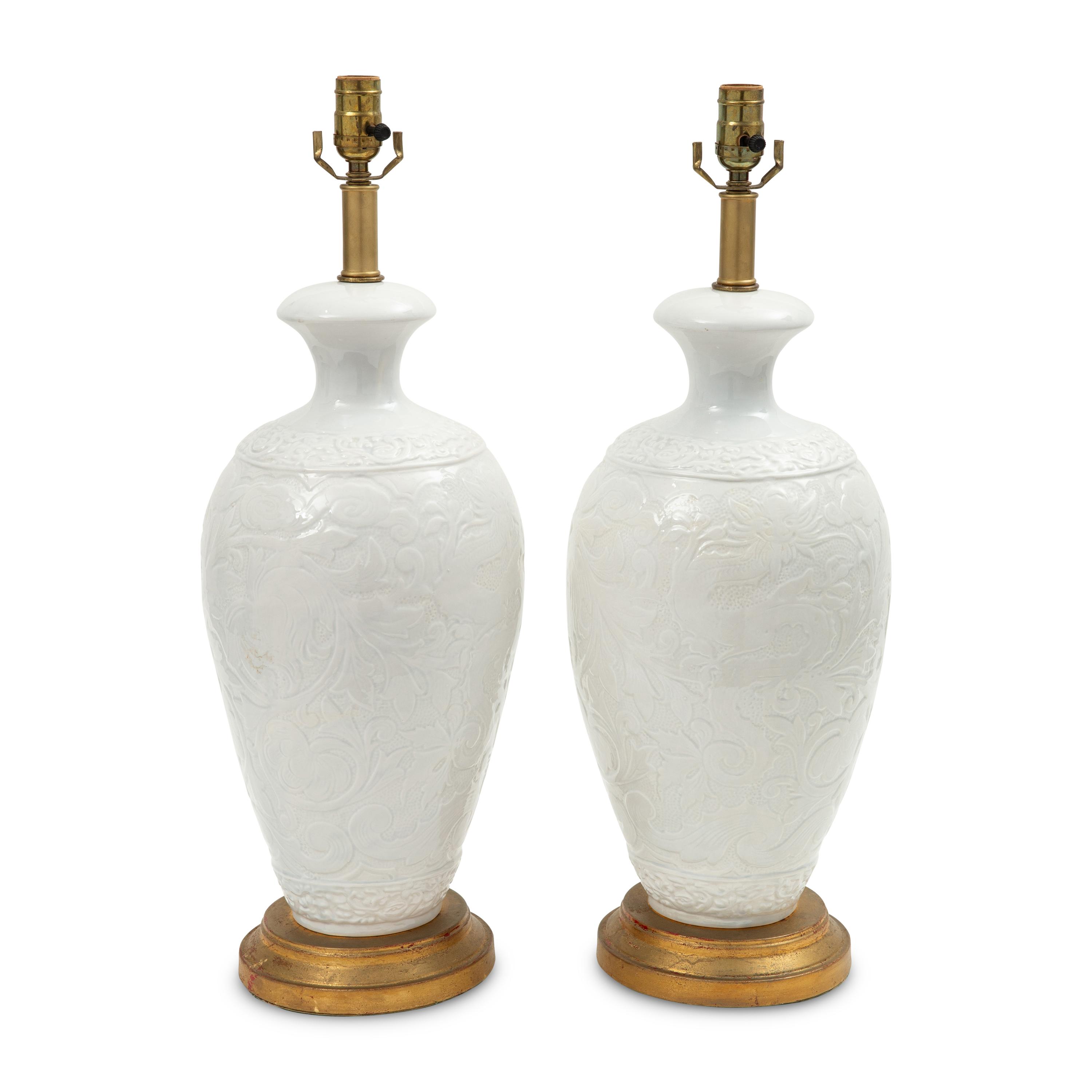 A Pair of White-Glazed Majolica Vases Mounted as Lamps