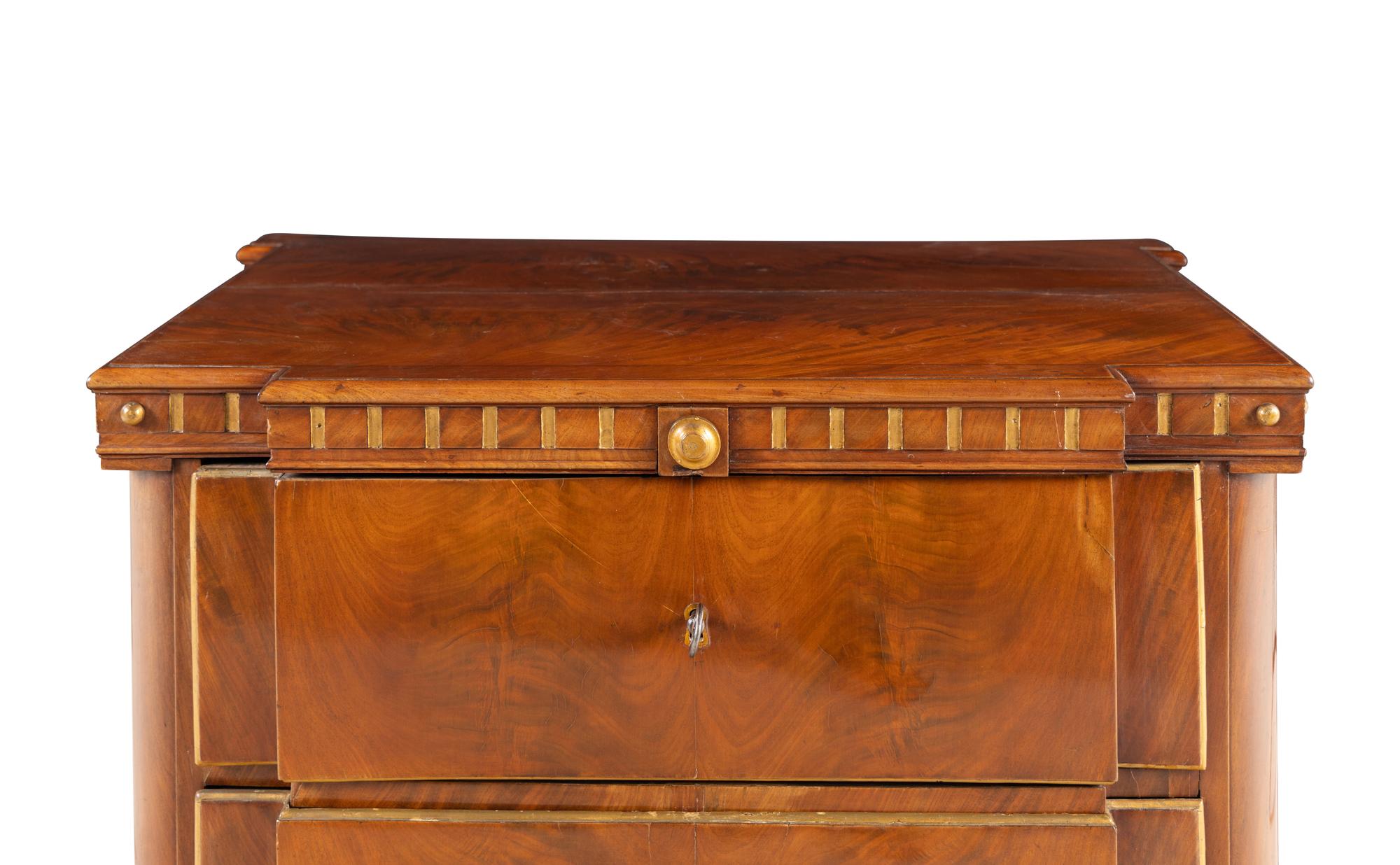 A Baltic Style Parcel Gilt Mahogany Chest of Drawers