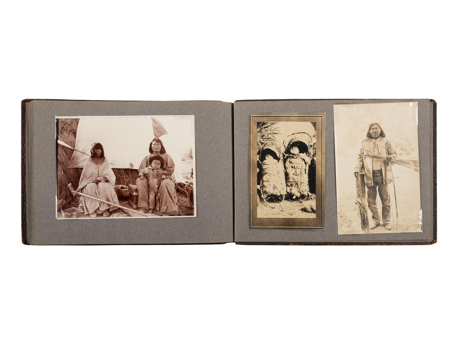 [NATIVE AMERICANS]. JONES, John Edward (1863-1922), photographer. Album containing 50 photographs of the San Carlos Indian Agency, including Apache civilians and police, agency buildings and dwellings, and scenic views. Ca 1904.