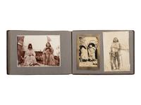 [NATIVE AMERICANS]. JONES, John Edward (1863-1922), photographer. Album containing 50 photographs of the San Carlos Indian Agency, including Apache civilians and police, agency buildings and dwellings, and scenic views. Ca 1904.