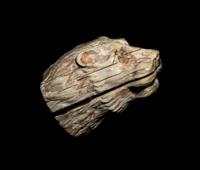 An Egyptian Bone Head of a Lion