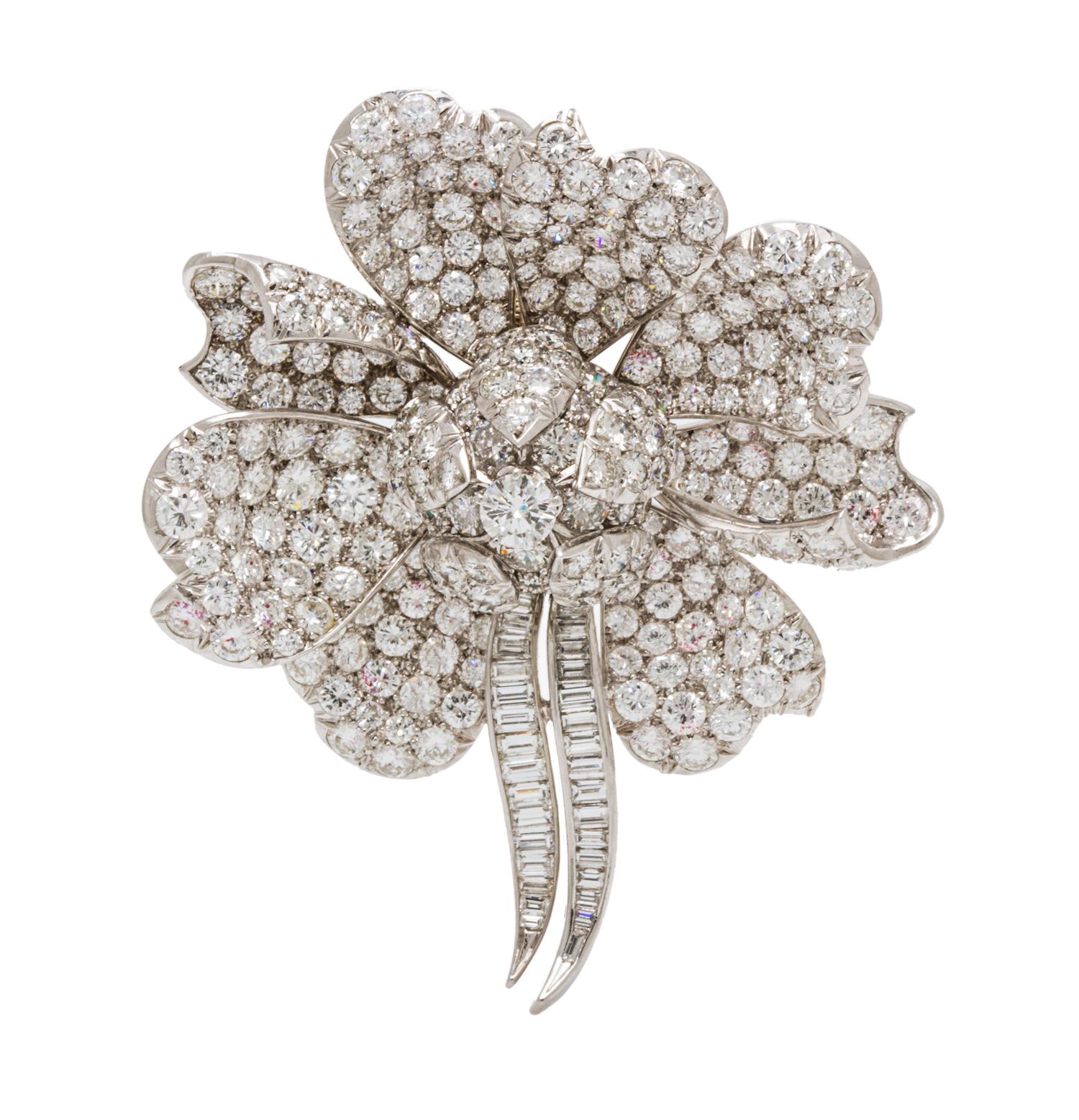 A Platinum and Diamond Flower Pendant/Brooch, 21.50 dwts.