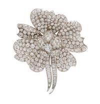 A Platinum and Diamond Flower Pendant/Brooch, 21.50 dwts.
